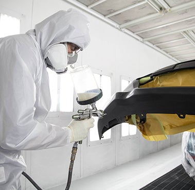 Collision Center Technician Painting a Vehicle | Gresham Toyota in Gresham OR